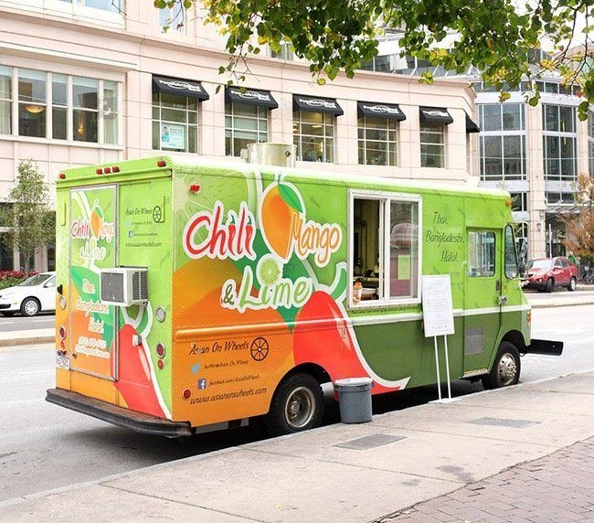 Brightly wrapped food truck parked on a city street